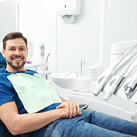 Endodontic patient in treatment chair smiling
